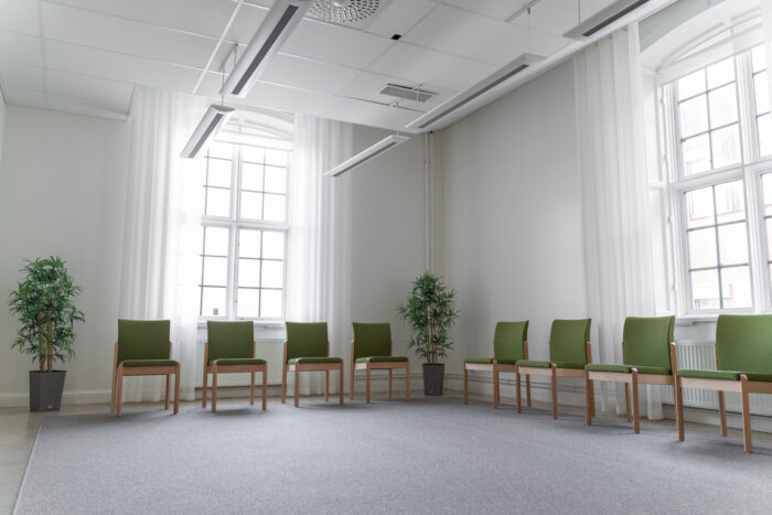 Room with chairs and some plants