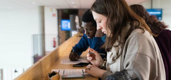 students filling out form